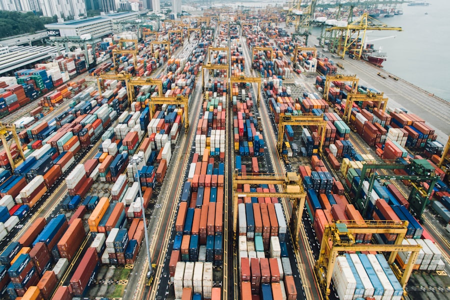 Stacked shipping containers at a port representing PayQuid Middle East trade